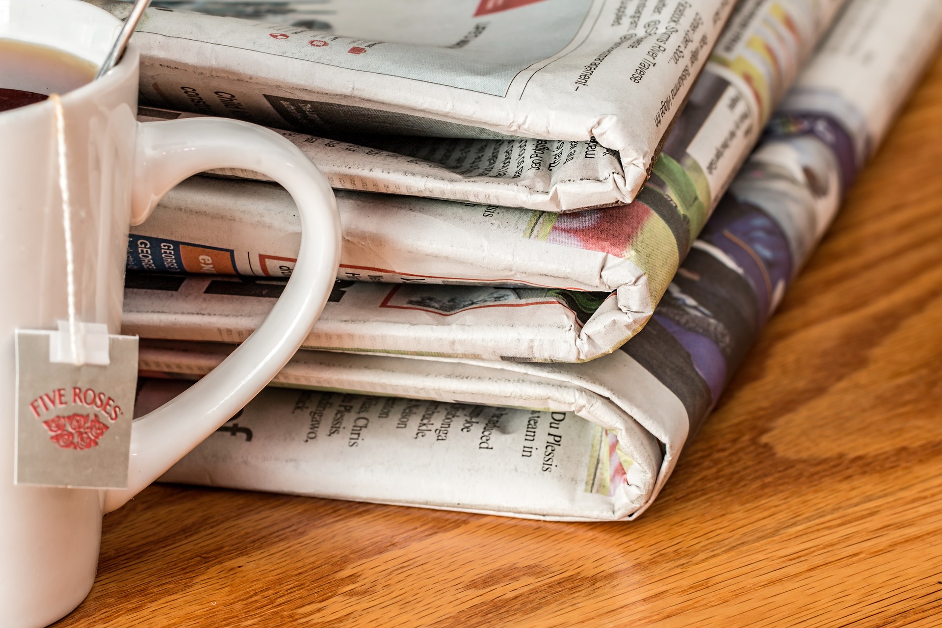 newspapers with tea